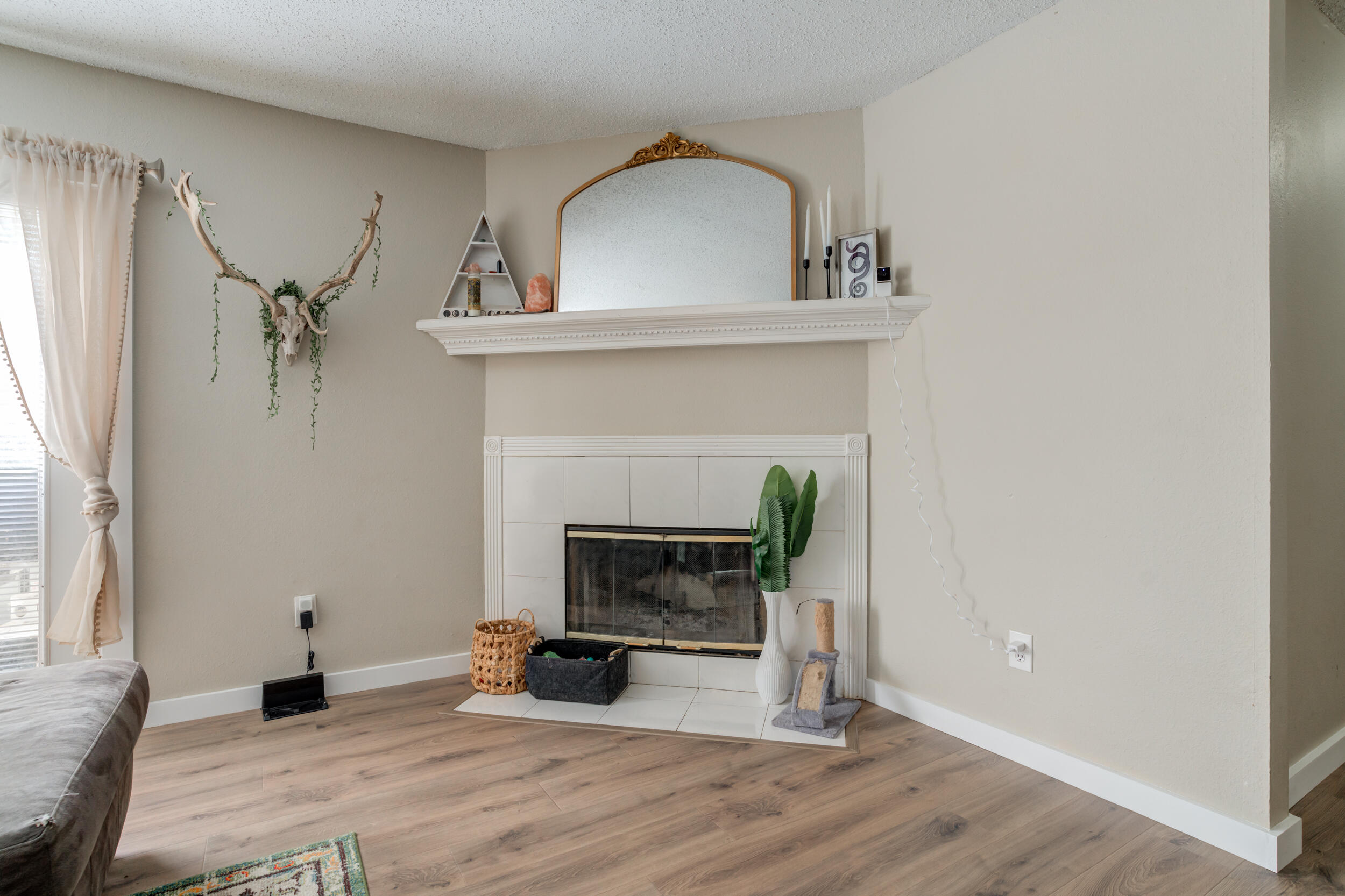 8406 Canton Avenue Lubbock, TX 79423 - Photo 9 of 25 a living room with furniture and a fireplace