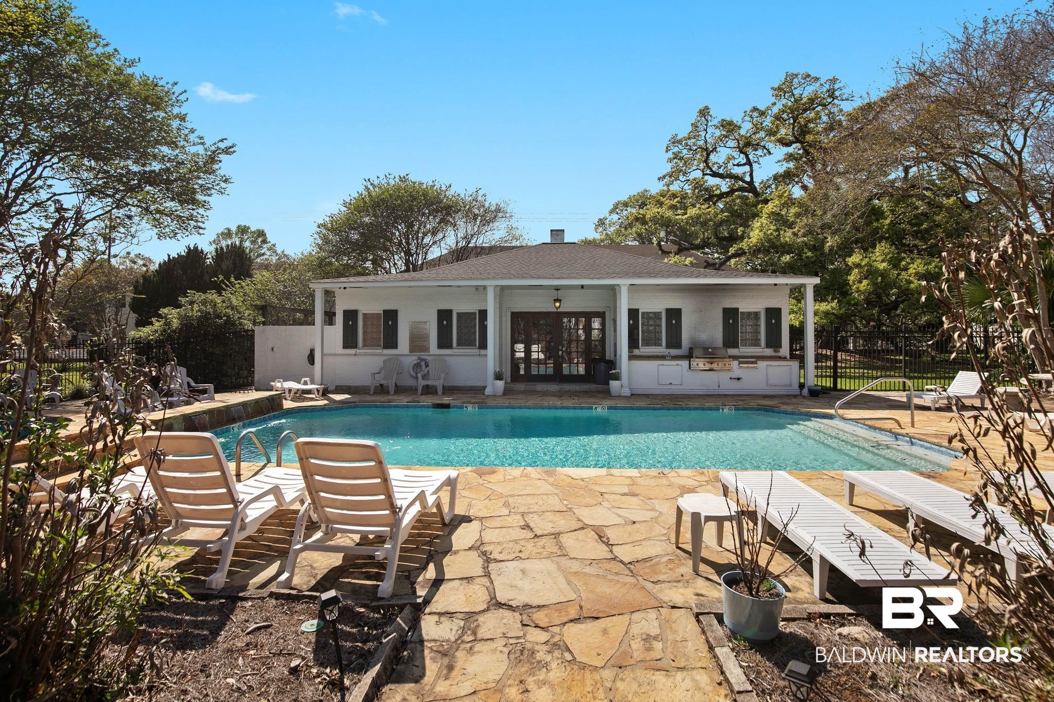 214 Upham Street, Unit 8D Mobile, AL 36607 - Photo 31 of 36 View of swimming pool featuring patio surround, grilling area, and french doors