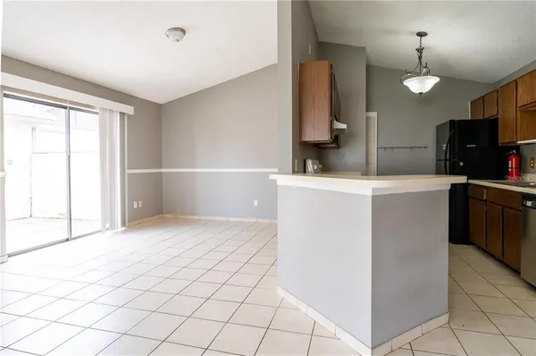 a kitchen with stainless steel appliances a sink and a refrigerator