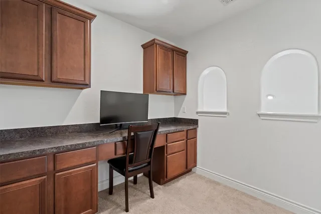 a room with two chair and appliances