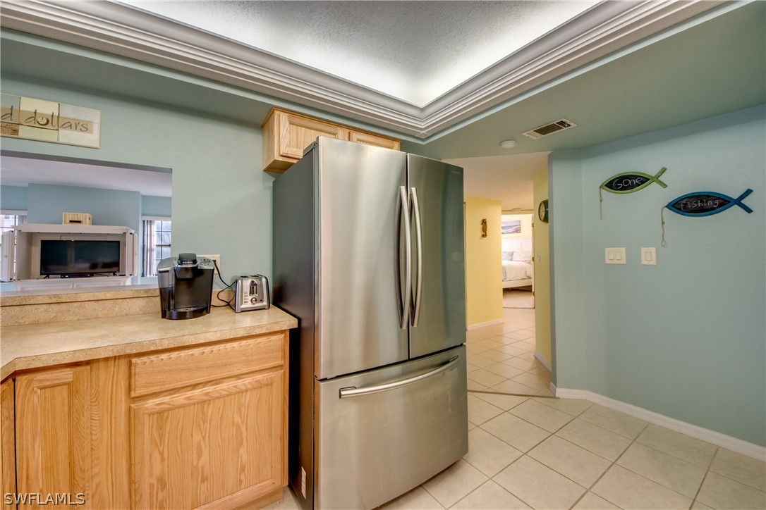 23465 Harbor View Road, Unit 1008 Port Charlotte, FL 33980 - Photo 13 of 33 a kitchen with stainless steel appliances a refrigerator sink and microwave