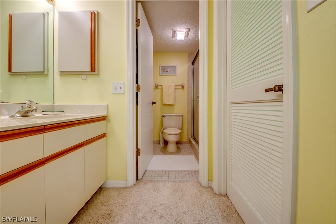 23465 Harbor View Road, Unit 1008 Port Charlotte, FL 33980 - Photo 15 of 33 a bathroom with a sink and a mirror