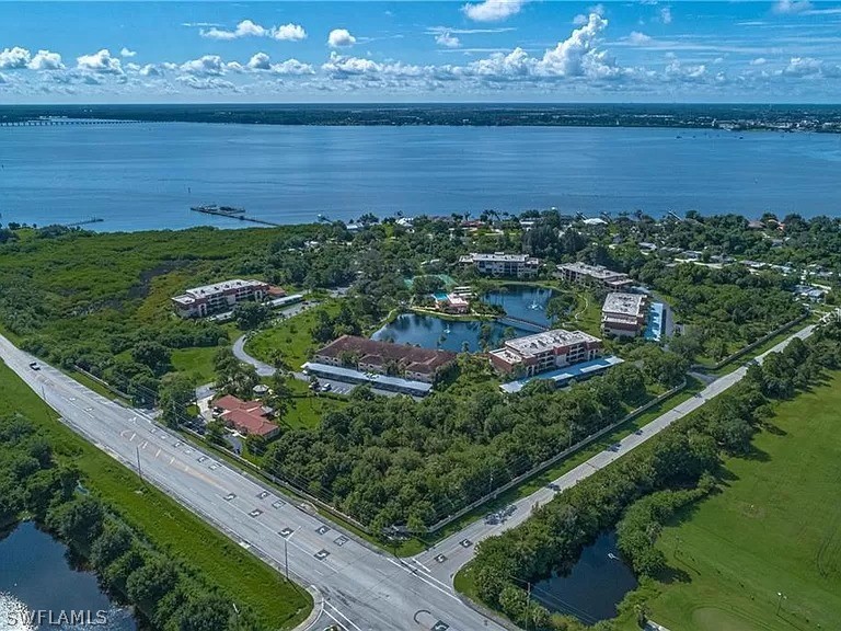 23465 Harbor View Road, Unit 1008 Port Charlotte, FL 33980 - Photo 21 of 33 a view of a lake from a balcony