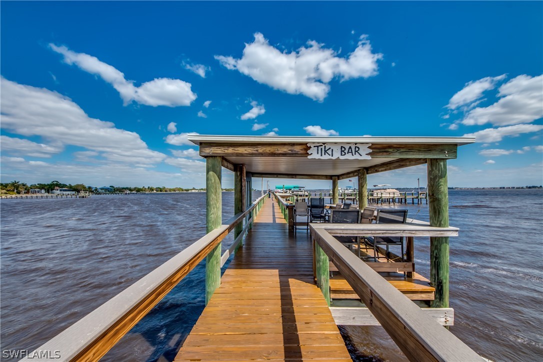 23465 Harbor View Road, Unit 1008 Port Charlotte, FL 33980 - Photo 28 of 33 a balcony with furniture and a potted plant