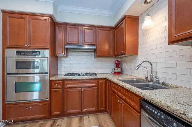 a living room with furniture a clock and a fireplace