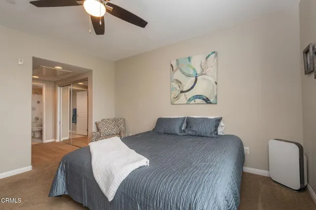 a view of a patio with a table and chairs and potted plants