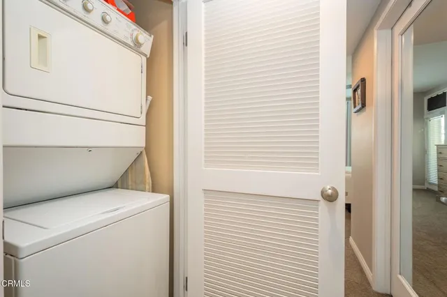 a view of a balcony with an outdoor seating