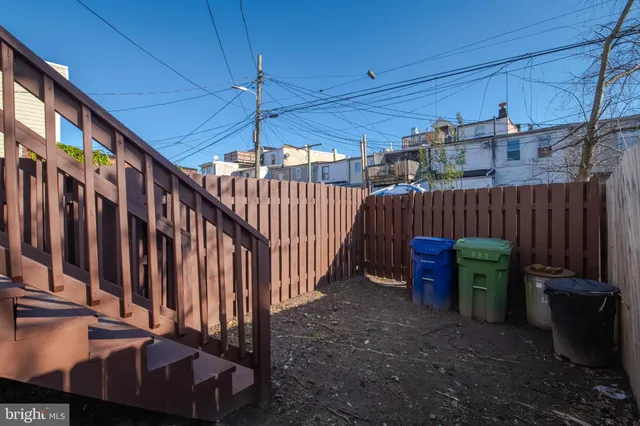 a view of a backyard with furniture