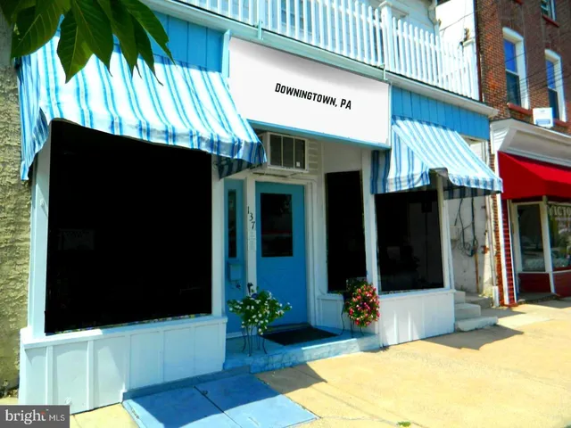 a view of a cafe with sitting area