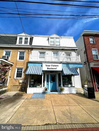 a view of a building with sitting area