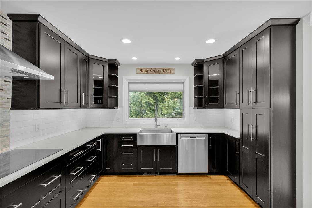3396 Darien Road Bethlehem, PA 18020 - Photo 11 of 44 An inviting kitchen with rich cabinetry and a sun-filled window above the sink.