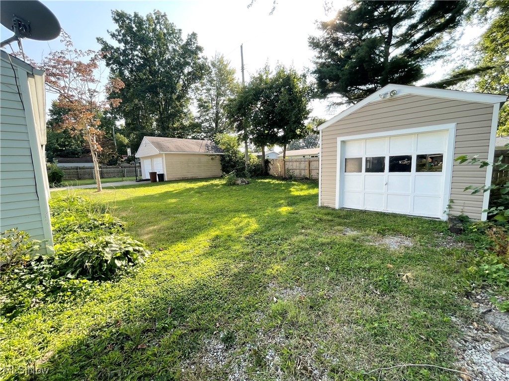 1816 Aberdeen Road Madison, OH 44057 - Photo 10 of 12 View of yard featuring an outdoor structure and a garage