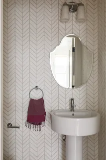 a bathroom with a sink and mirror