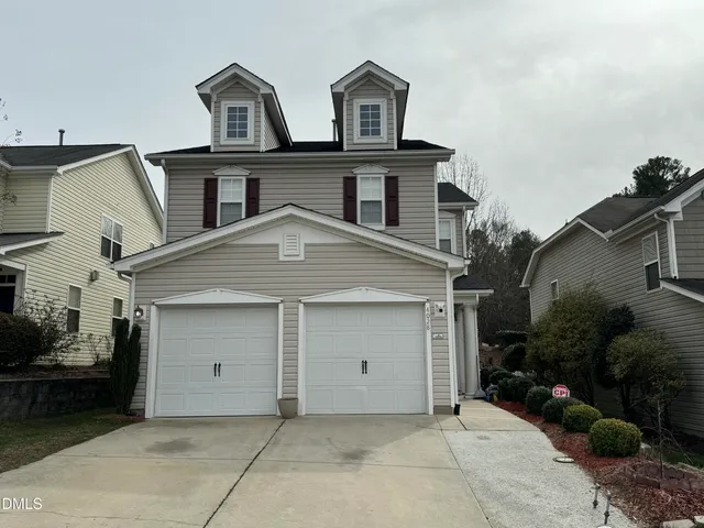 a view of a house with a garage