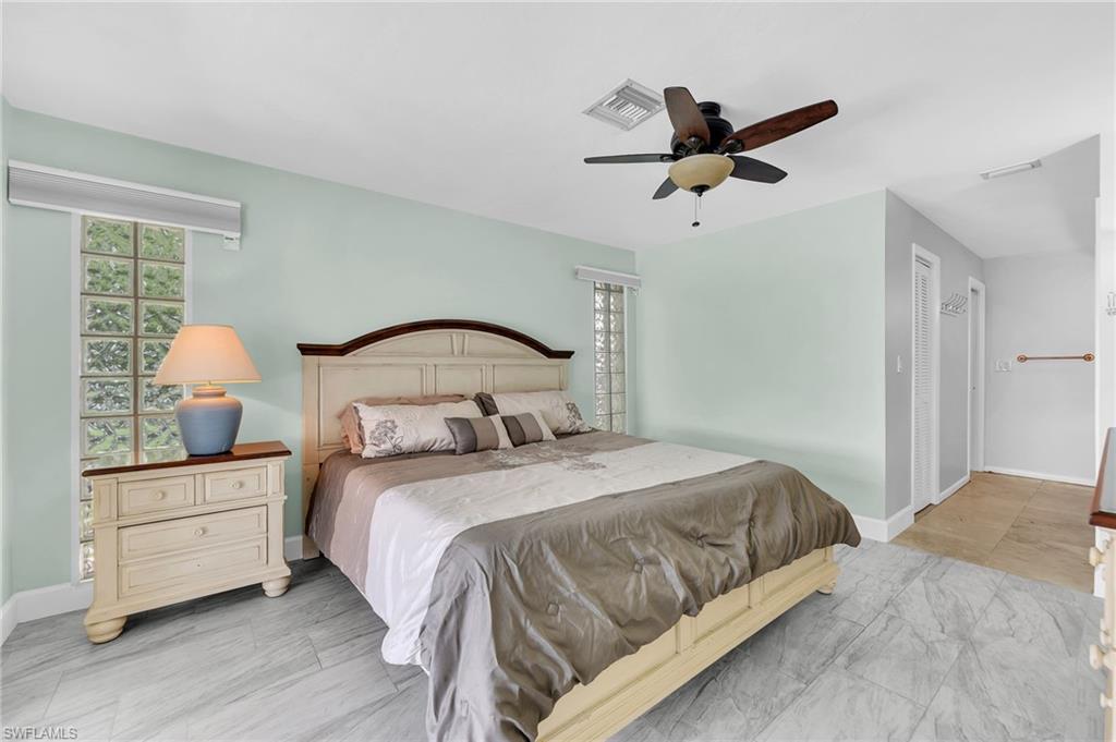 3065 50th Lane Southwest Naples, FL 34116 - Photo 13 of 31 a bedroom with a bed and window