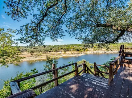 a view of a lake with a house in the background