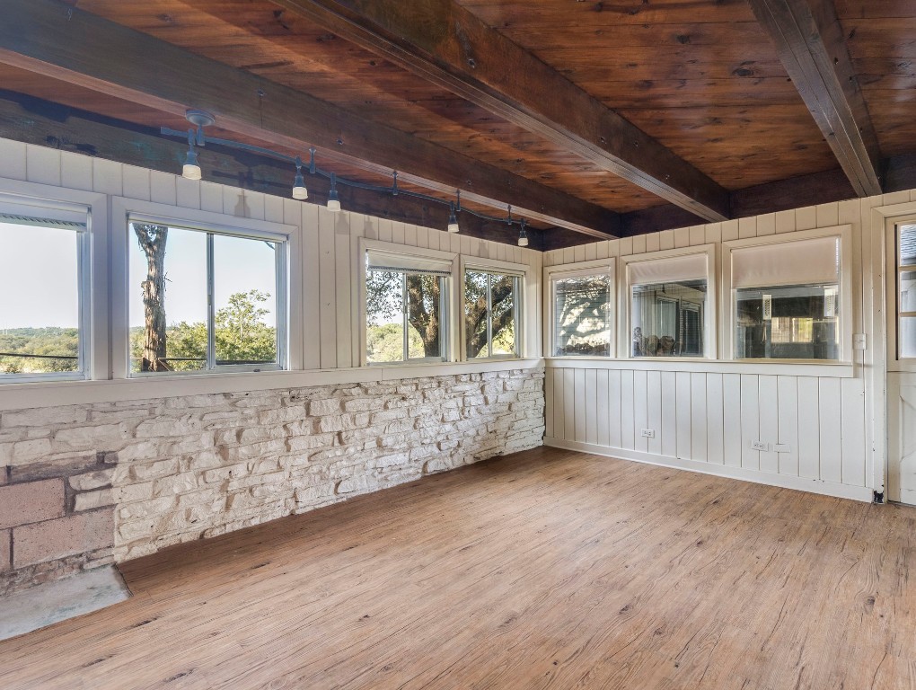 236 Cedar Hurst Lane Austin, TX 78734 - Photo 16 of 31 a view of an empty room with a window and wooden floor