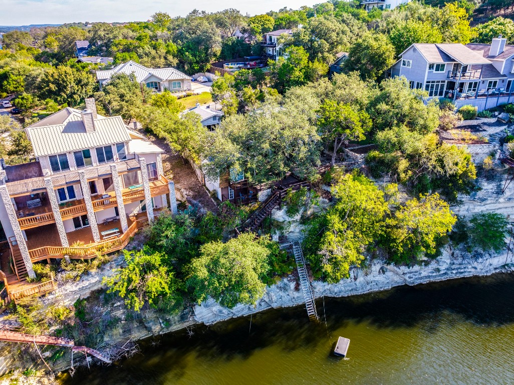 236 Cedar Hurst Lane Austin, TX 78734 - Photo 2 of 31 a view of a lake with a house in the background