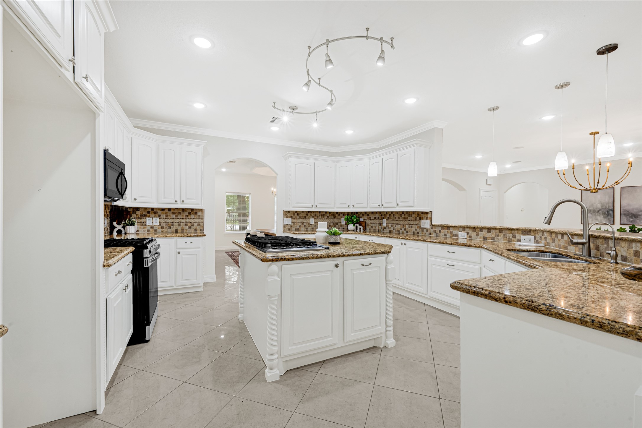 404 Moss Street Houston, TX 77009 - Photo 14 of 39 a kitchen with stainless steel appliances granite countertop a sink and stove
