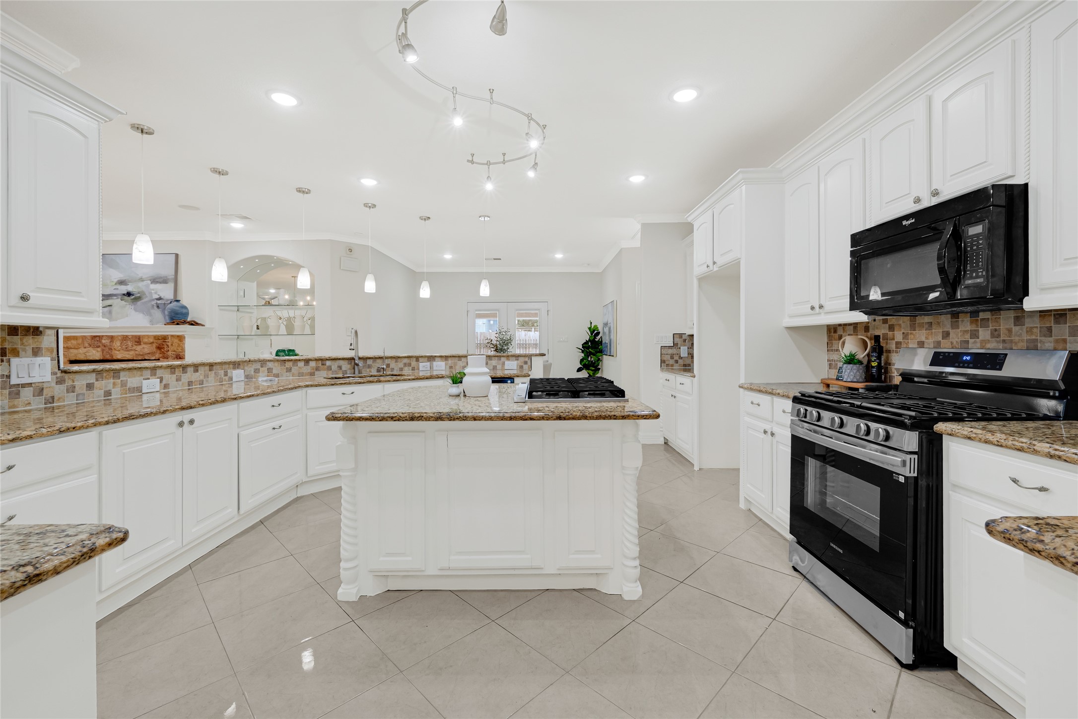 404 Moss Street Houston, TX 77009 - Photo 15 of 39 a kitchen with stainless steel appliances granite countertop a sink and a stove