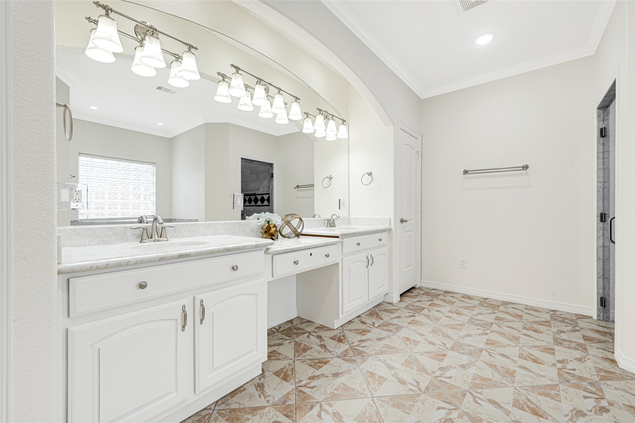 404 Moss Street Houston, TX 77009 - Photo 19 of 39 a spacious bathroom with a sink mirror and a shower