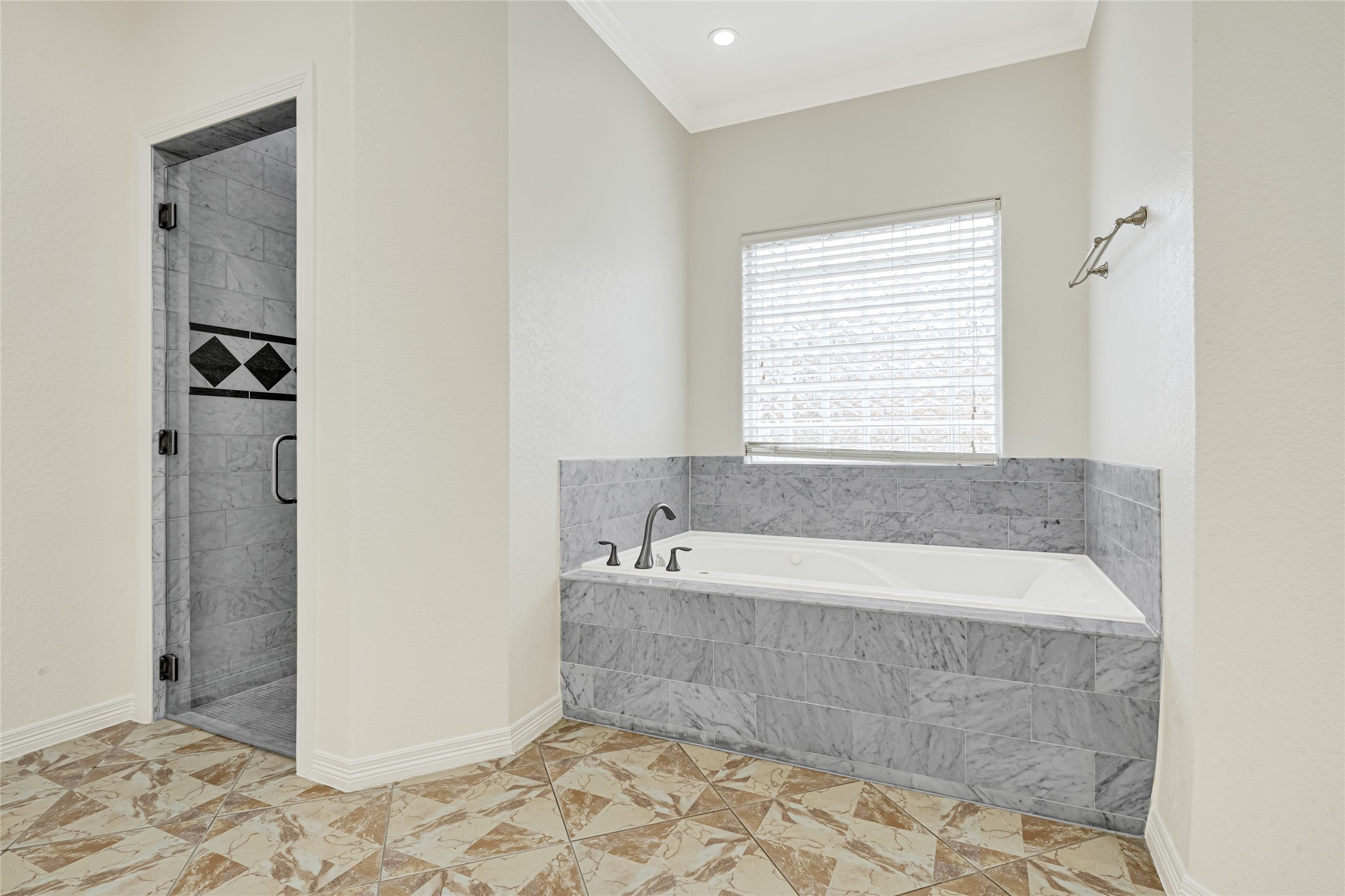 404 Moss Street Houston, TX 77009 - Photo 20 of 39 a bathroom with a bathtub and a shower