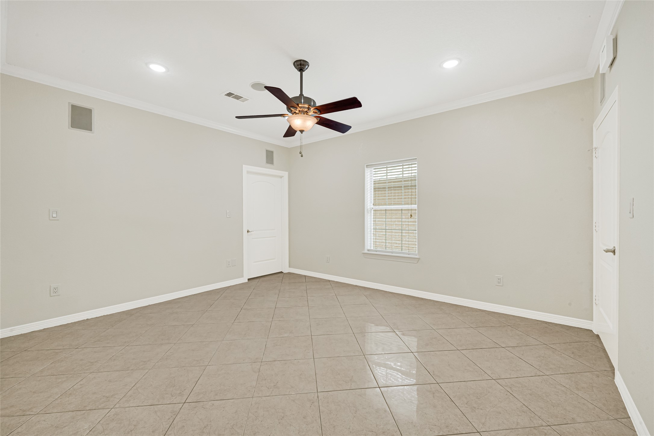 404 Moss Street Houston, TX 77009 - Photo 28 of 39 a view of an empty room with a ceiling fan