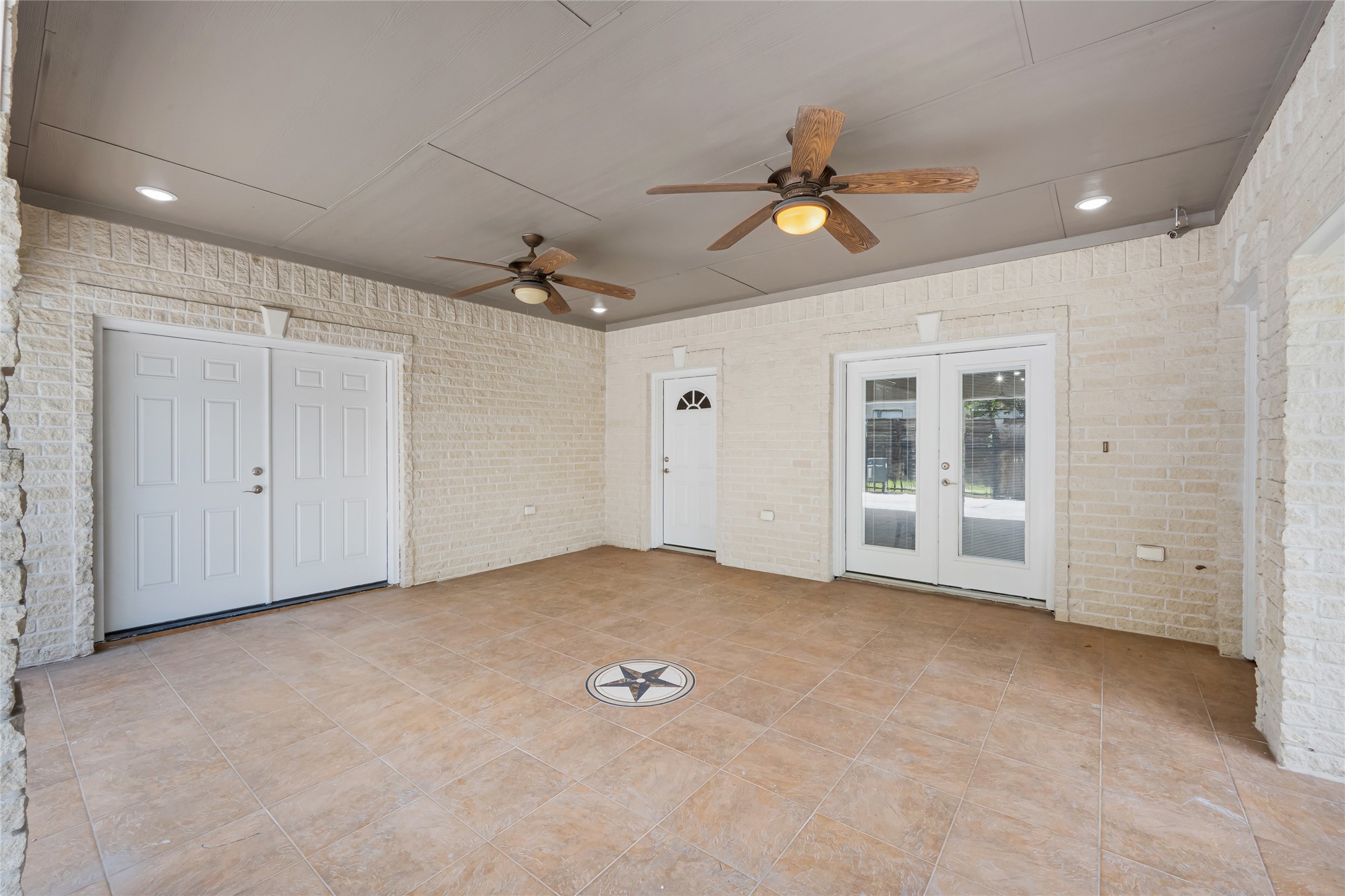 404 Moss Street Houston, TX 77009 - Photo 36 of 39 an empty room with chandelier fan and windows