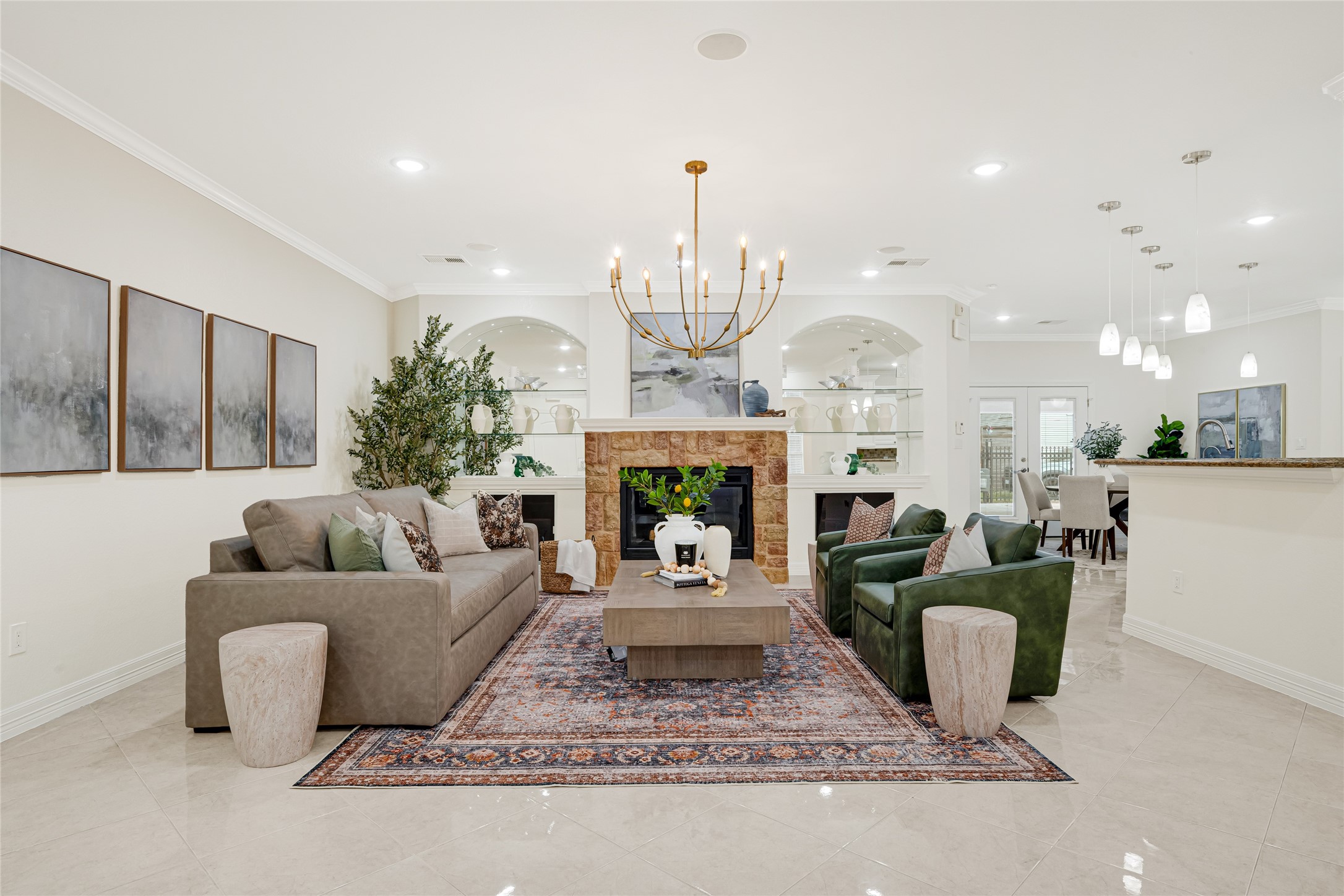 404 Moss Street Houston, TX 77009 - Photo 8 of 39 a living room with furniture a fireplace and a chandelier