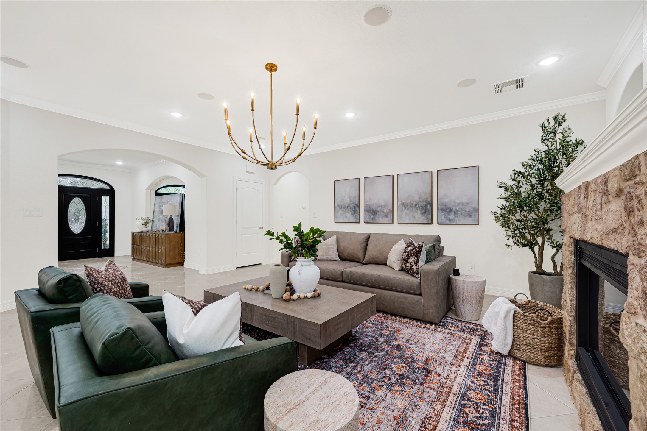 404 Moss Street Houston, TX 77009 - Photo 10 of 39 a living room with furniture a fireplace a rug and a chandelier