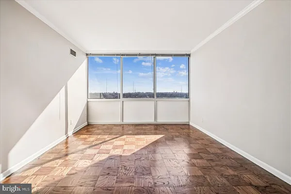 a view of an empty room with a window