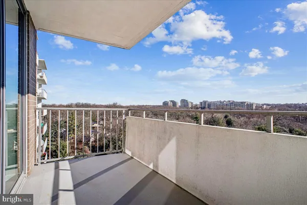 a view of a balcony with city view