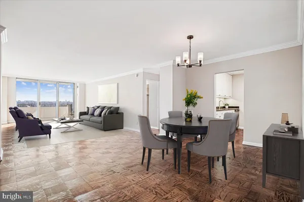 a living room with furniture chandelier and a chandelier