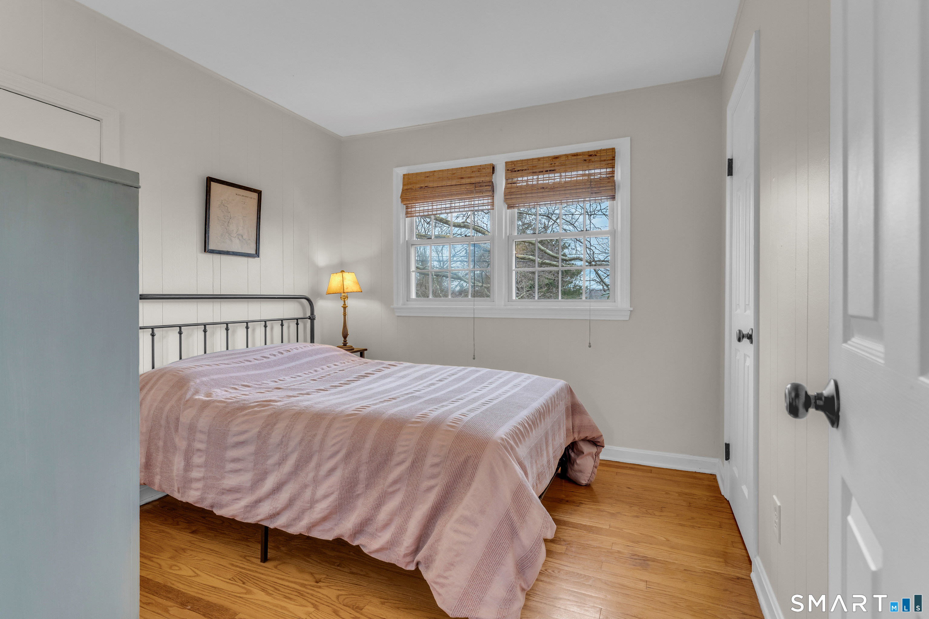 82 Raymond Road Guilford, CT 06437 - Photo 14 of 33 a bedroom with a bed and window
