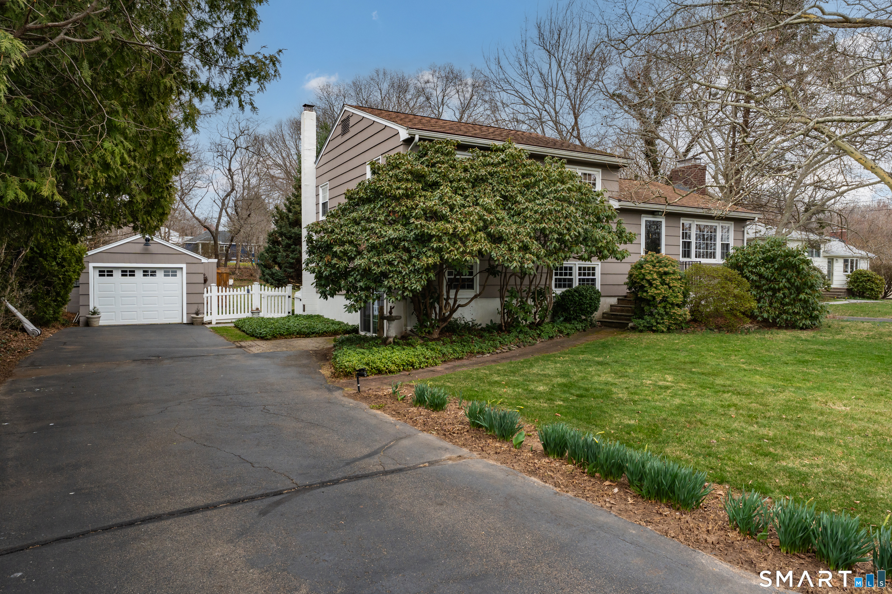 82 Raymond Road Guilford, CT 06437 - Photo 2 of 33 a view of a house with a yard