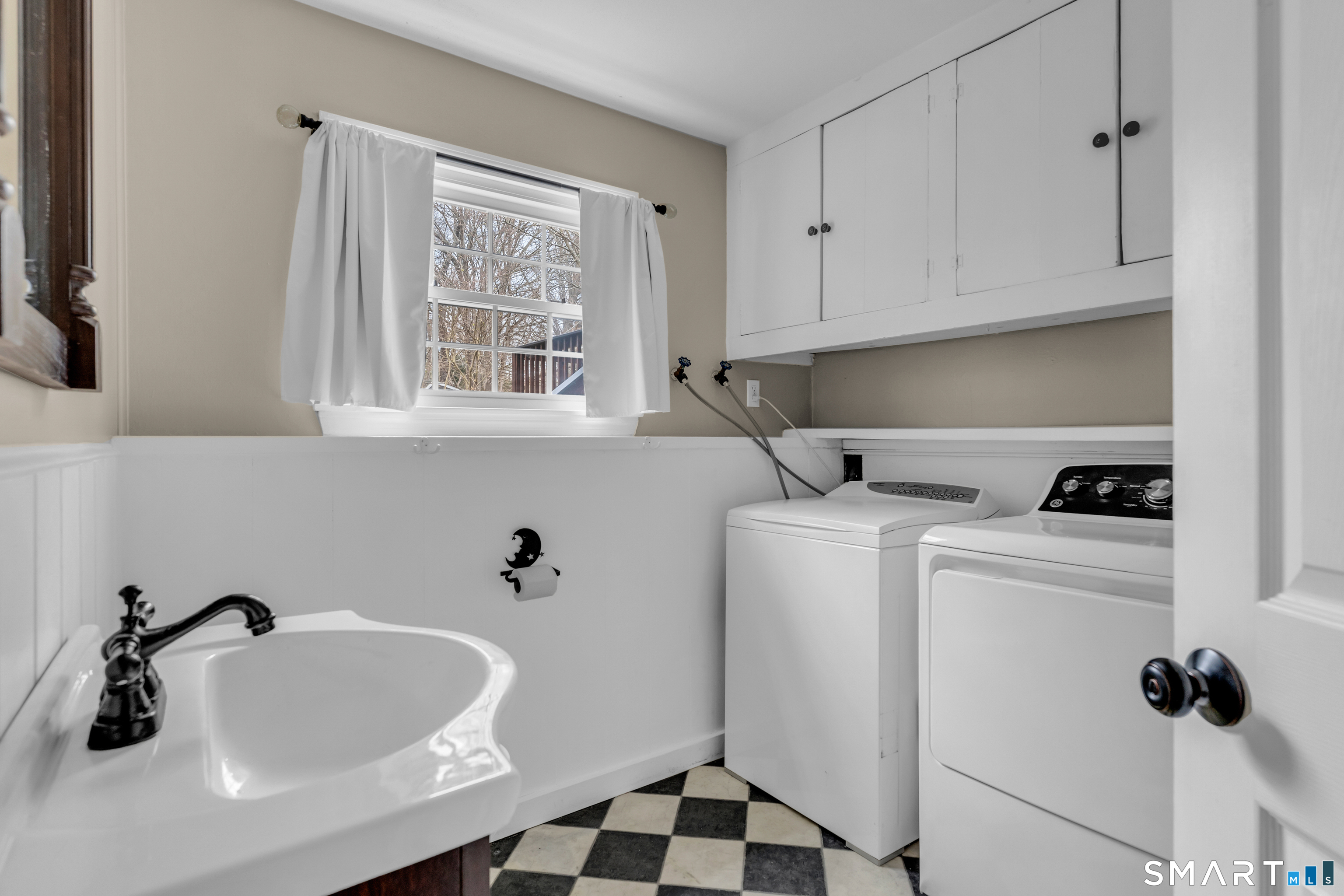 82 Raymond Road Guilford, CT 06437 - Photo 21 of 33 a bathroom with a sink and a window