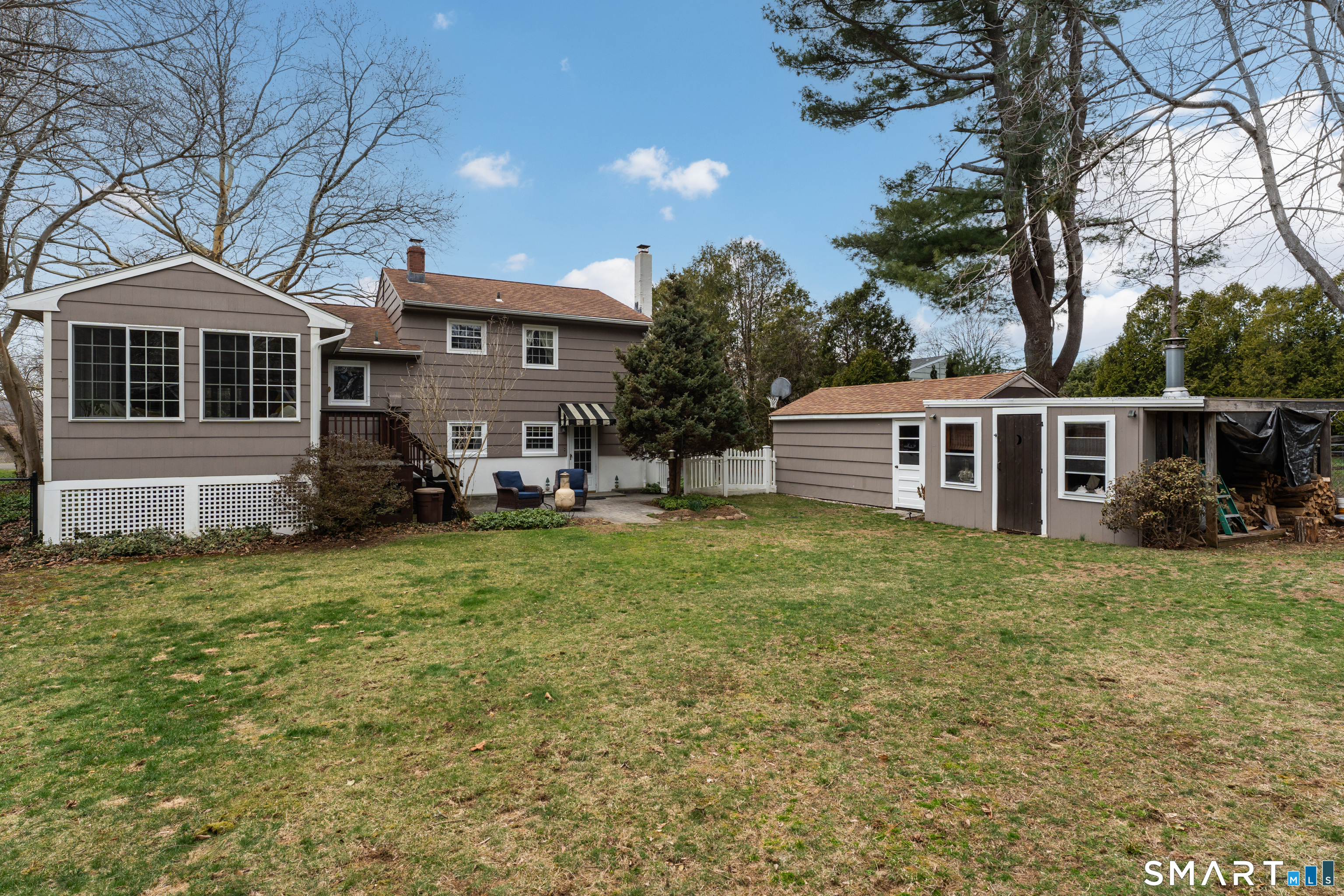 82 Raymond Road Guilford, CT 06437 - Photo 25 of 33 a front view of a house with a garden
