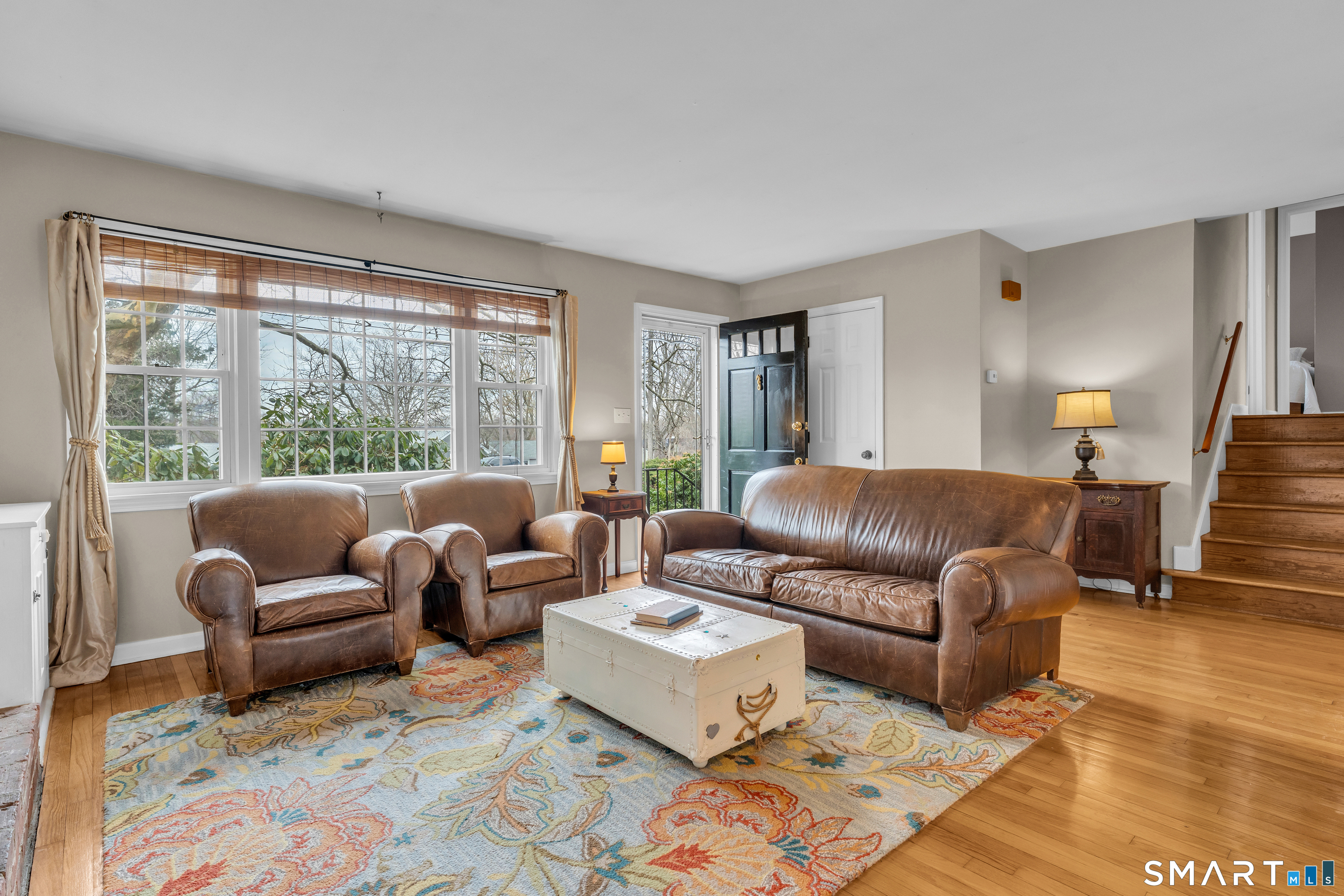 82 Raymond Road Guilford, CT 06437 - Photo 3 of 33 a living room with furniture and a large window