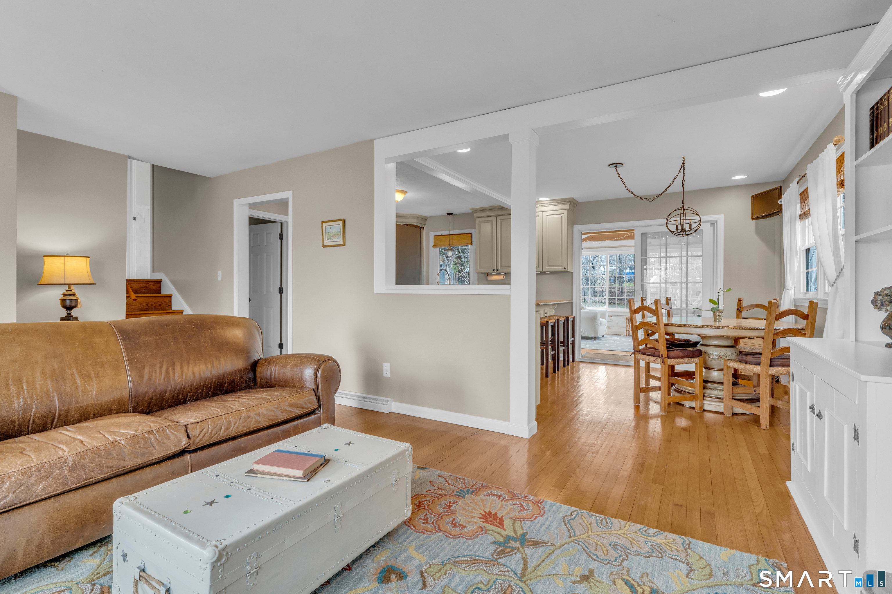 82 Raymond Road Guilford, CT 06437 - Photo 5 of 33 a living room with furniture and wooden floor