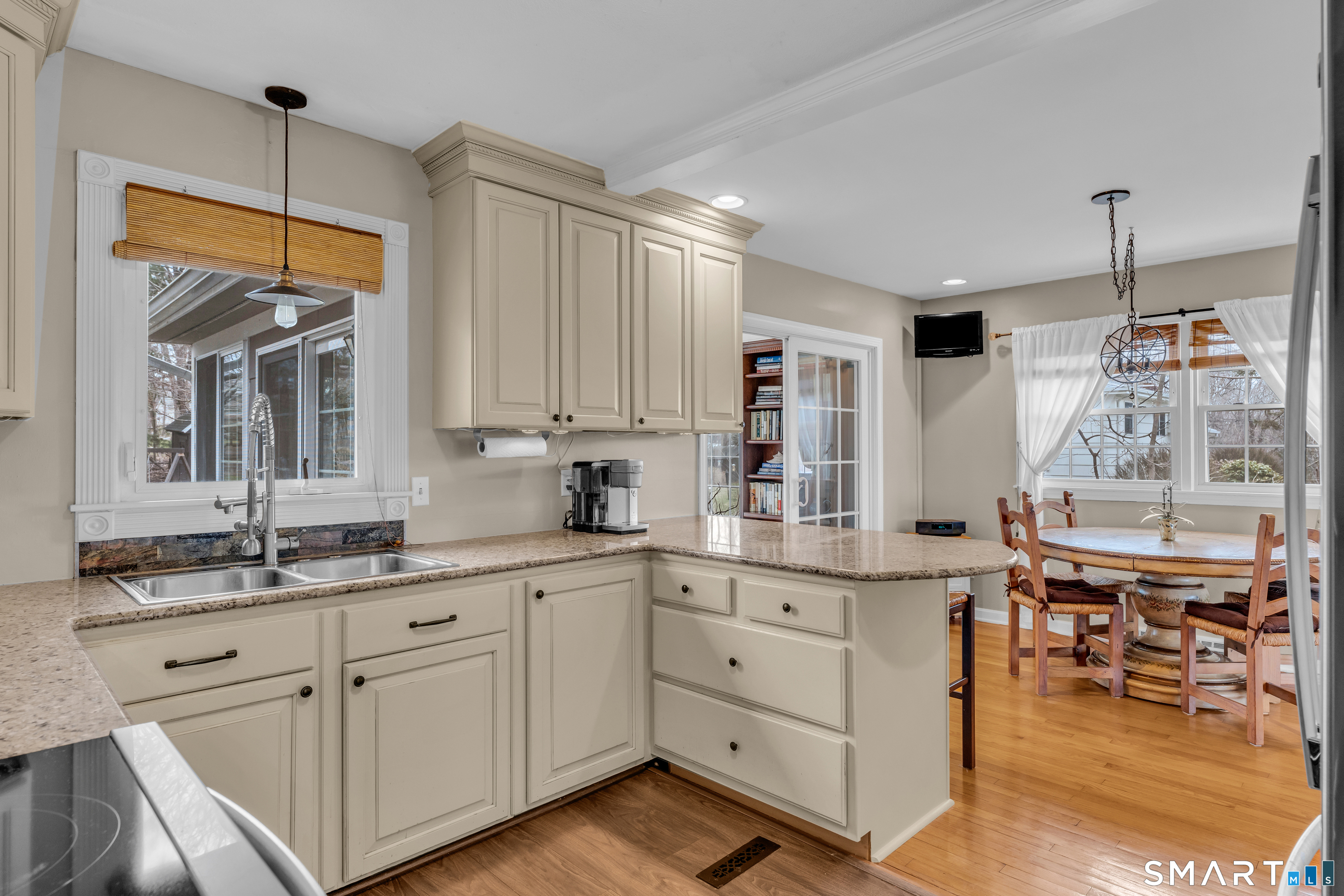 82 Raymond Road Guilford, CT 06437 - Photo 7 of 33 a kitchen with cabinets and window