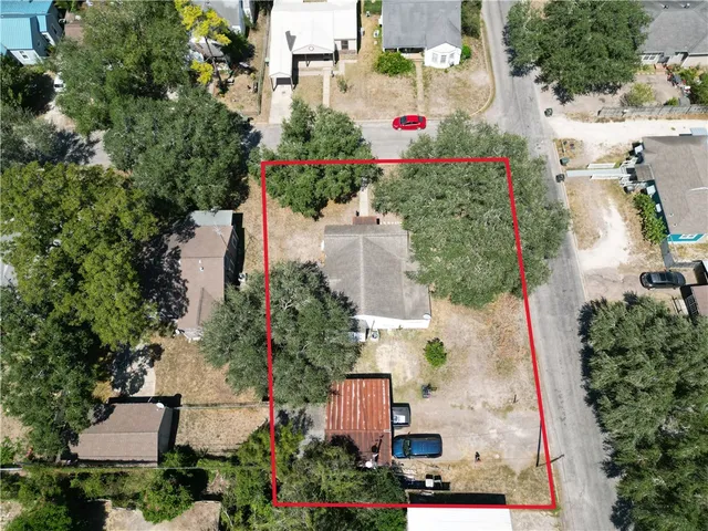 an aerial view of residential houses and street