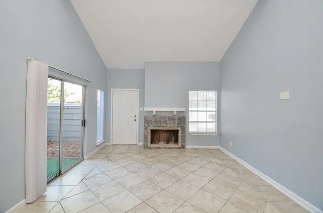 an empty room with fireplace