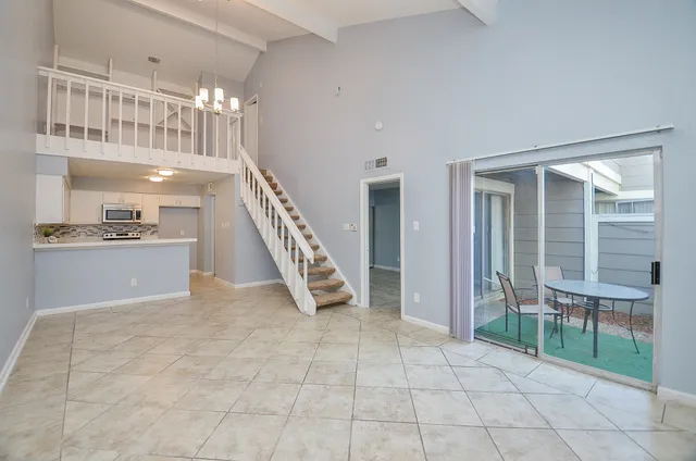 a view of a hallway with seating area