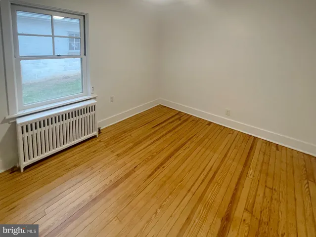 a view of a room with wooden floor and wooden floor