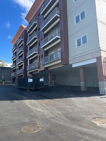 a front view of a building with a street