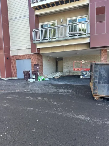 a front view of a house with parking