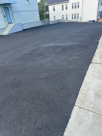 a view of a house with a street