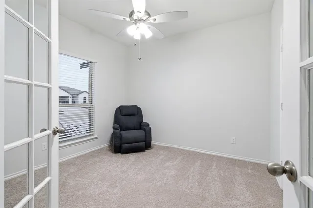 an empty room with furniture and a couch