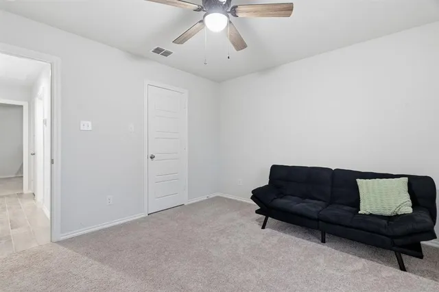 a room with a baby crib and a dresser