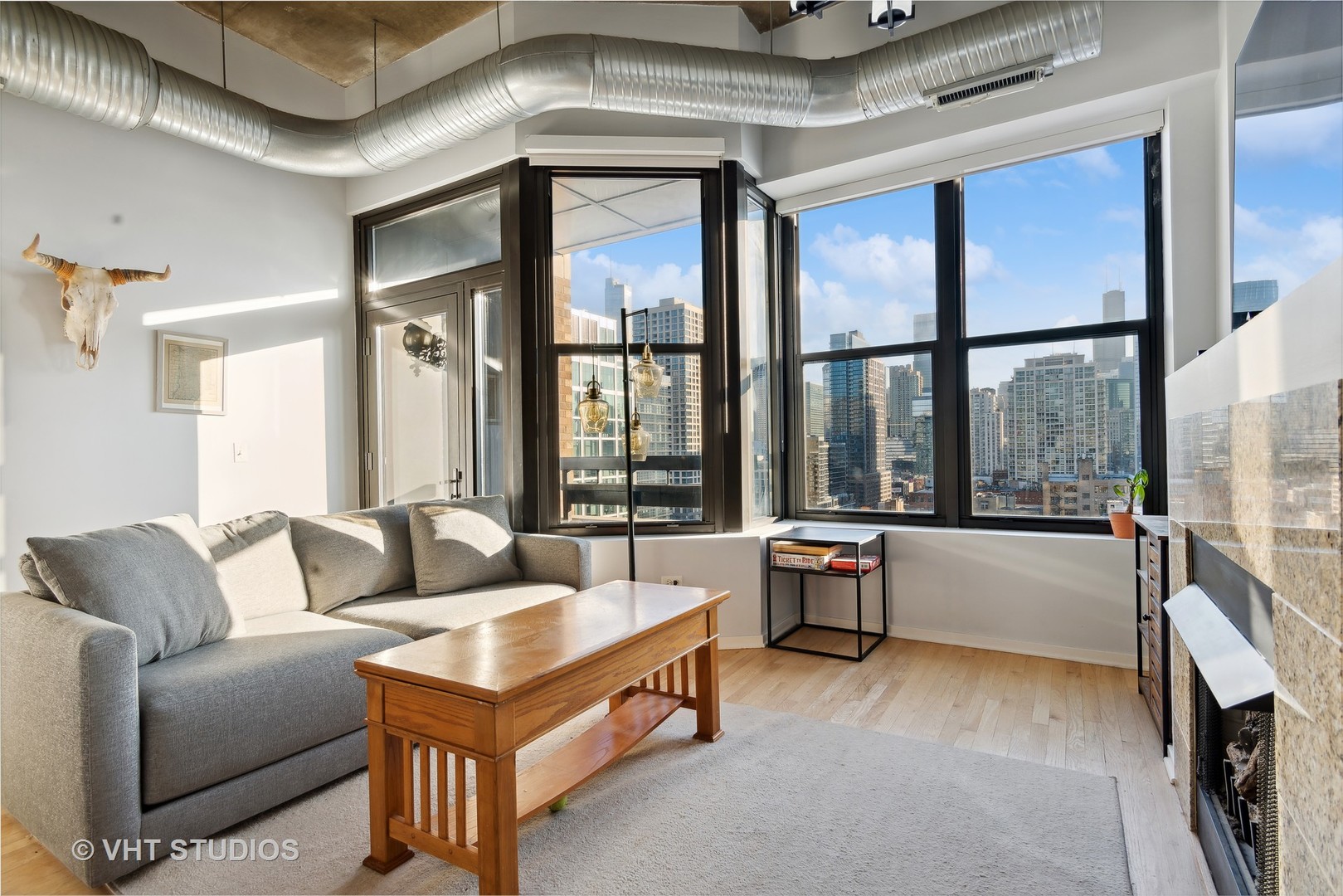 849 North Franklin Street, Unit 1419 Chicago, IL 60610 - Photo 2 of 10 a living room with furniture and a large window